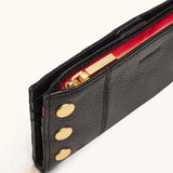 110 North-Black, Brushed Gold, Red Zipper